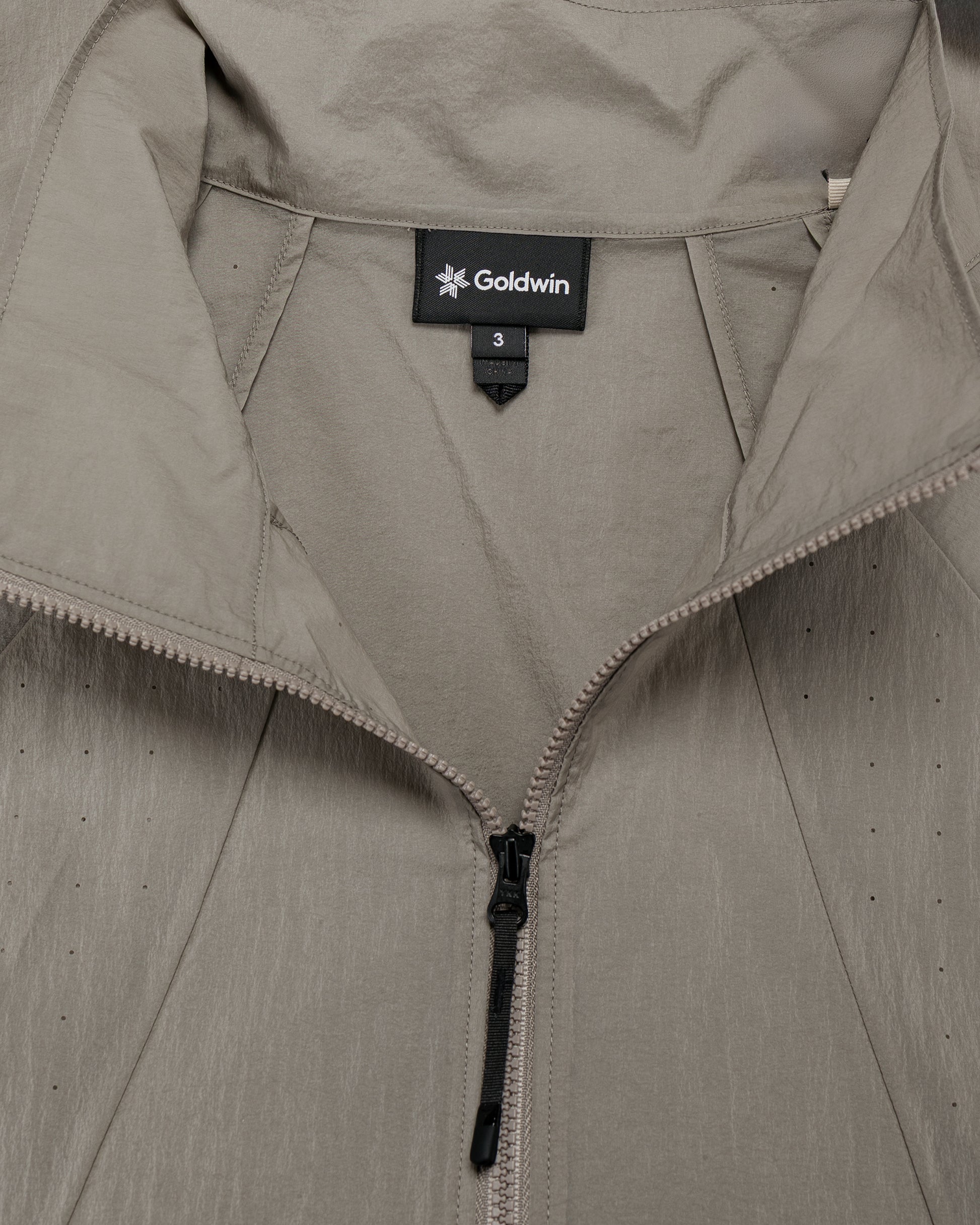 lost & found Goldwin Goldwin Sheer Nylon Wind Jacket Arid Beige